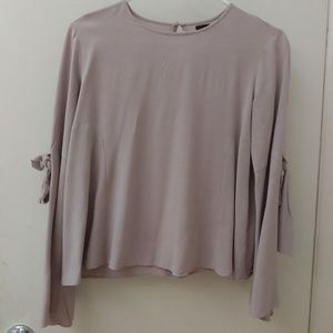 Beautiful blouse with ribbons on sleeves